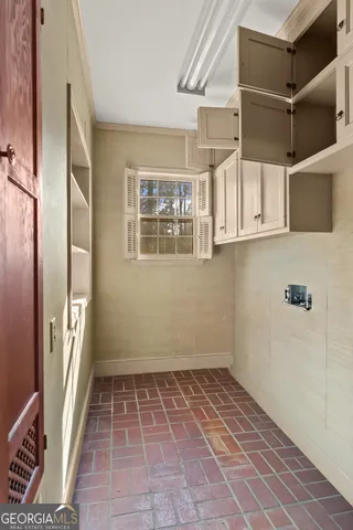 a view of staircase with wooden floor and fan