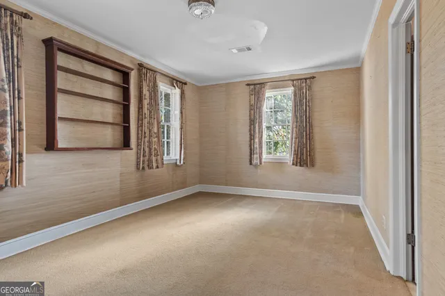 a bathroom with a sink toilet and window