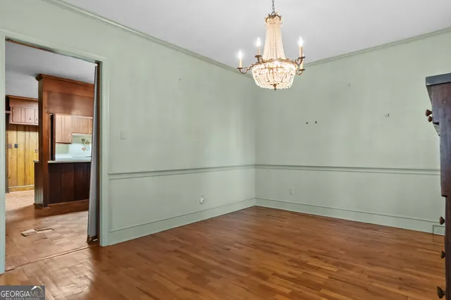 a view of a kitchen with furniture and staircase