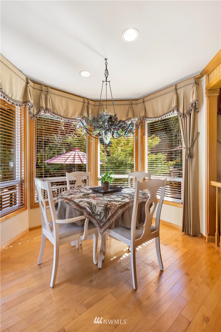 4916 177th Place Southeast Bothell, WA 98012 - Photo 13 of 25 a view of a dining room with furniture window and outside view