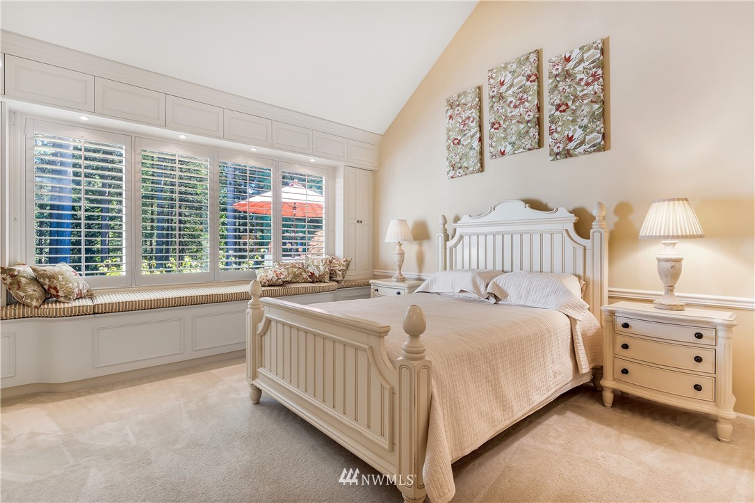 4916 177th Place Southeast Bothell, WA 98012 - Photo 16 of 25 a bedroom with a bed and a large window