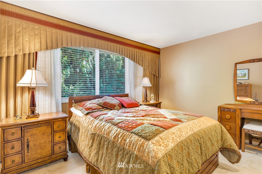 4916 177th Place Southeast Bothell, WA 98012 - Photo 19 of 25 a bedroom with a bed and a window