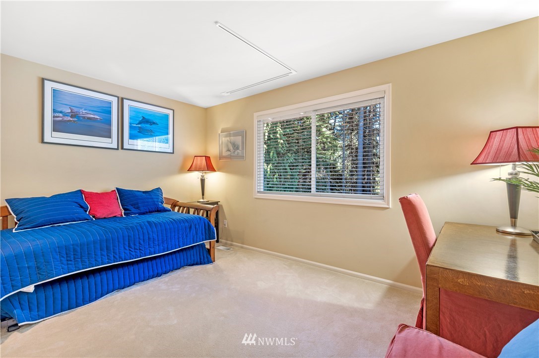 4916 177th Place Southeast Bothell, WA 98012 - Photo 20 of 25 a living room with furniture and a window