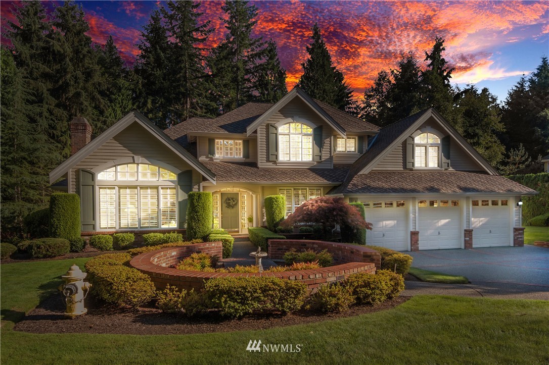 4916 177th Place Southeast Bothell, WA 98012 - Photo 24 of 25 a front view of a house with a yard