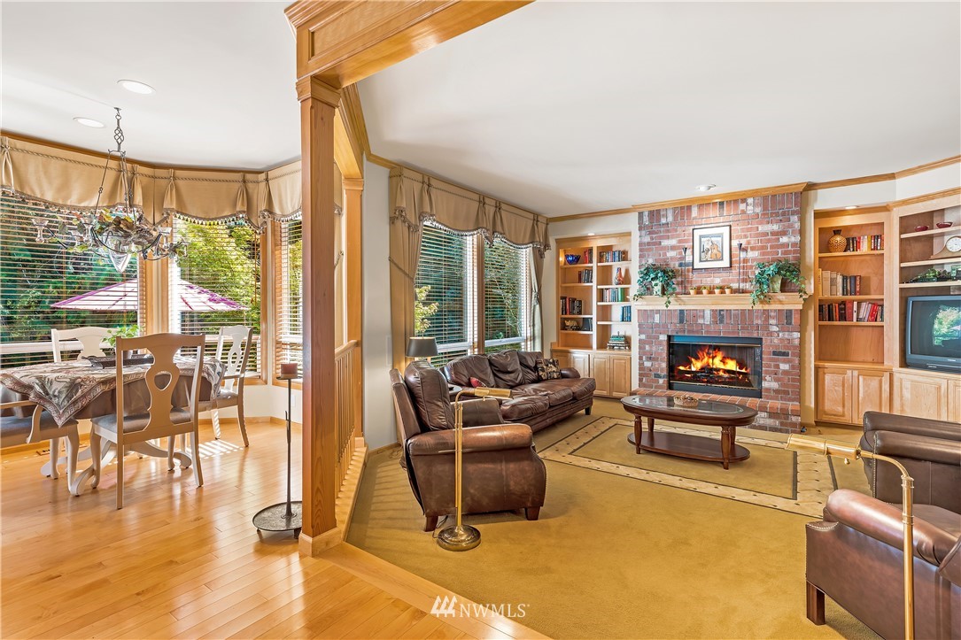4916 177th Place Southeast Bothell, WA 98012 - Photo 8 of 25 a living room with furniture and a floor to ceiling window