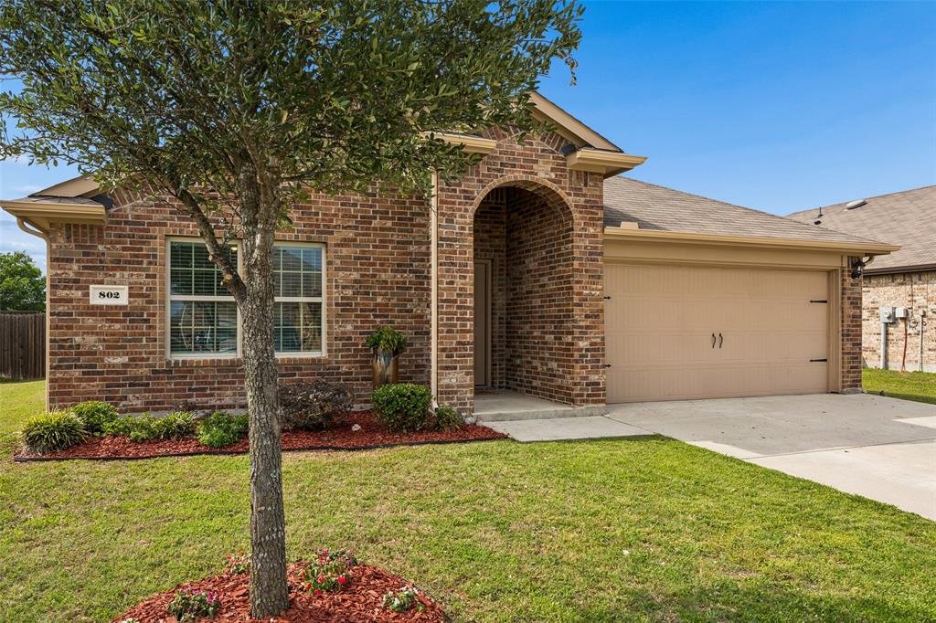 802 Rustic Way Royse City, TX 75189 - Photo 6 of 38 a front view of a house with garden