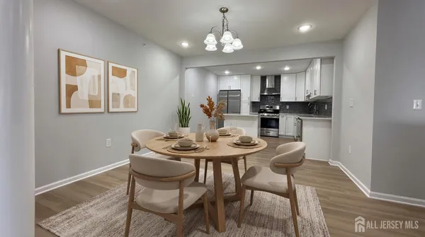 a view of a dining room with furniture and wooden floor