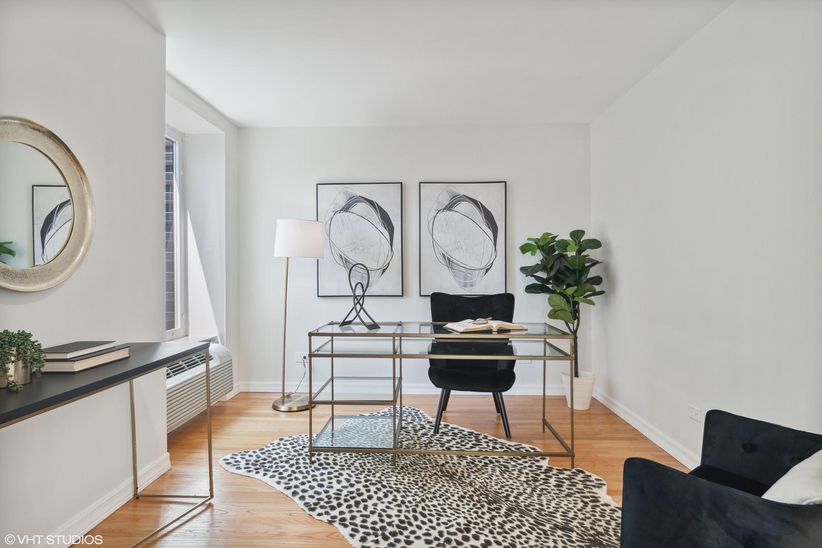 40 East Delaware Place, Unit 1602 Chicago, IL 60611 - Photo 12 of 27 a living room with furniture a rug and a potted plant