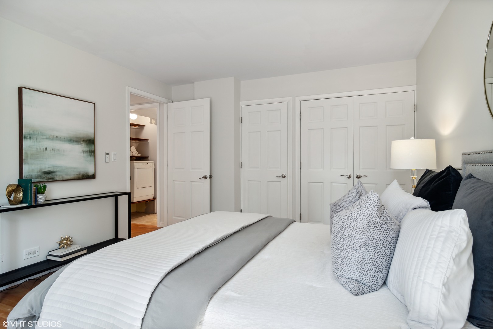 40 East Delaware Place, Unit 1602 Chicago, IL 60611 - Photo 18 of 27 a bedroom with a large bed and a flat screen tv