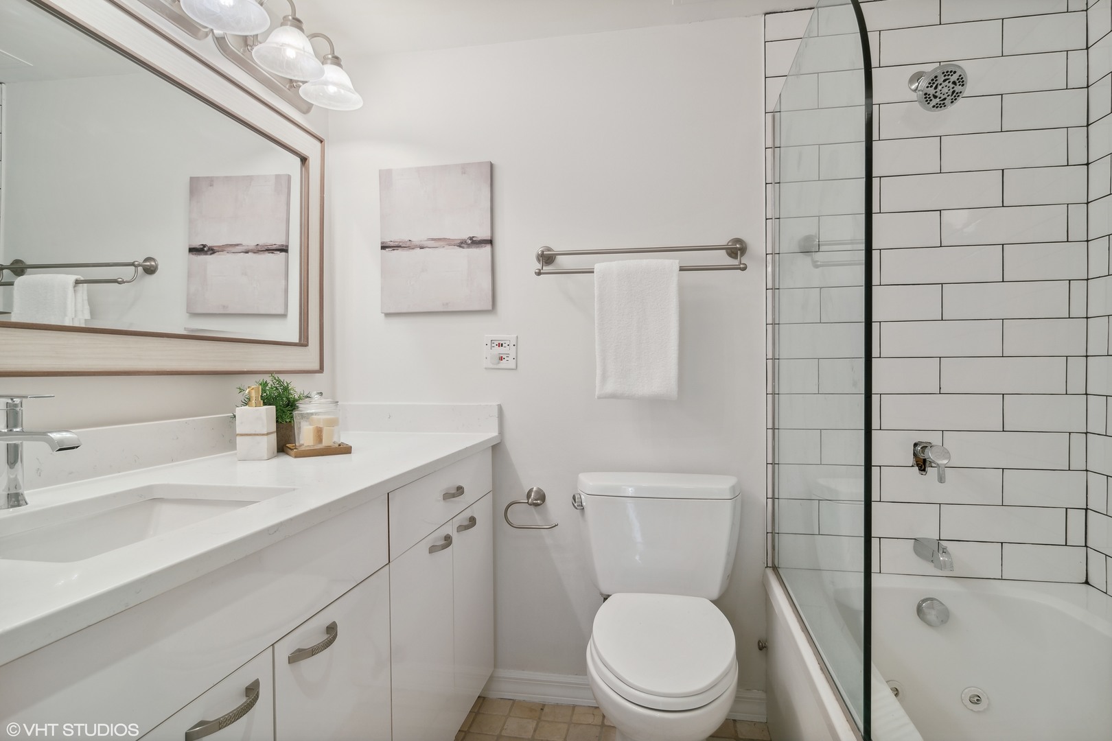 40 East Delaware Place, Unit 1602 Chicago, IL 60611 - Photo 19 of 27 a bathroom with a sink a toilet and shower