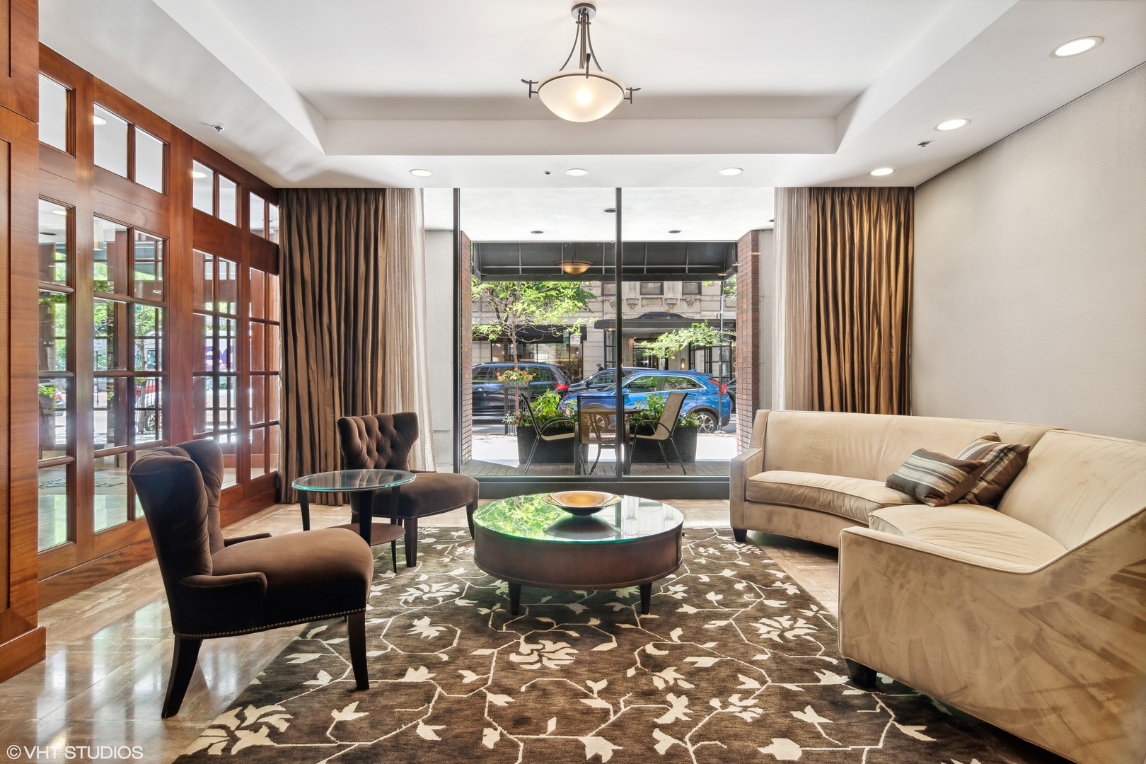 40 East Delaware Place, Unit 1602 Chicago, IL 60611 - Photo 2 of 27 a living room with furniture and a large window