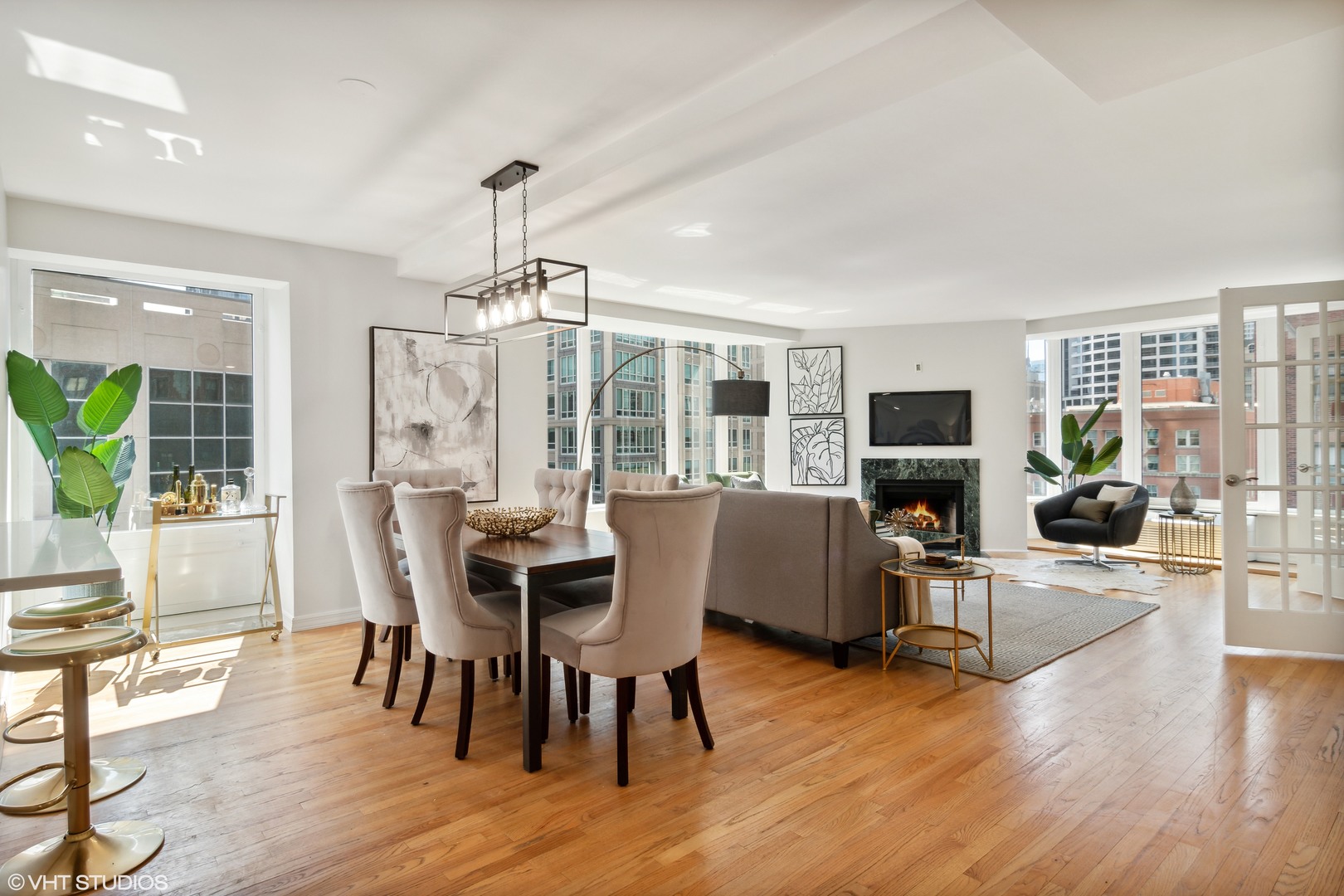 40 East Delaware Place, Unit 1602 Chicago, IL 60611 - Photo 5 of 27 a view of a dining room with furniture window and wooden floor