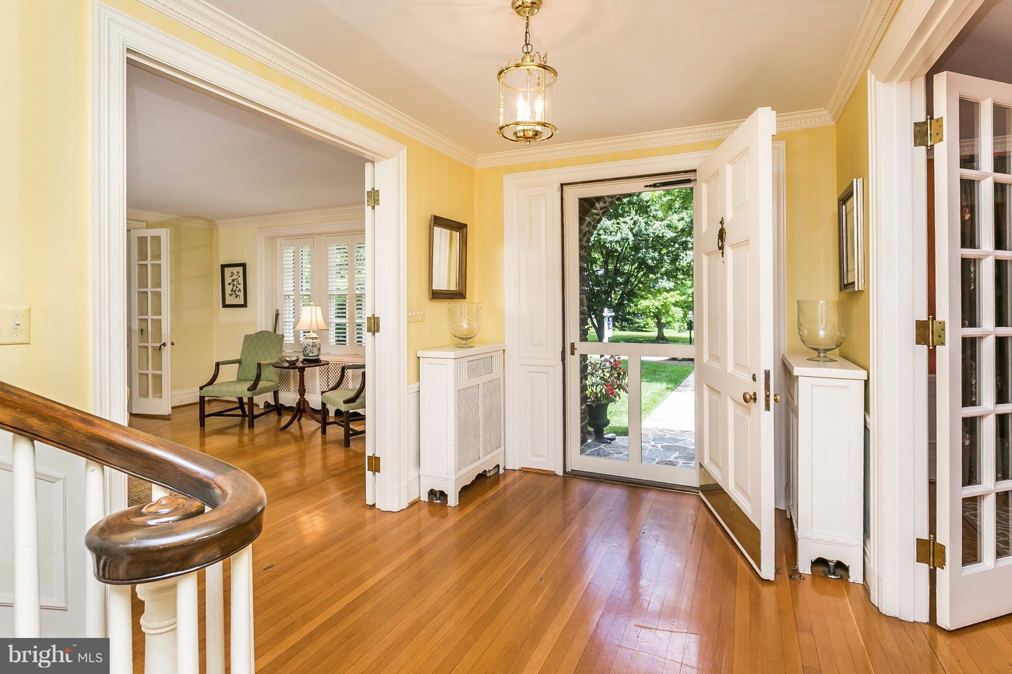 6306 Blenheim Road Baltimore, MD 21212 - Photo 2 of 30 a view of a hallway with wooden floor windows and entryway