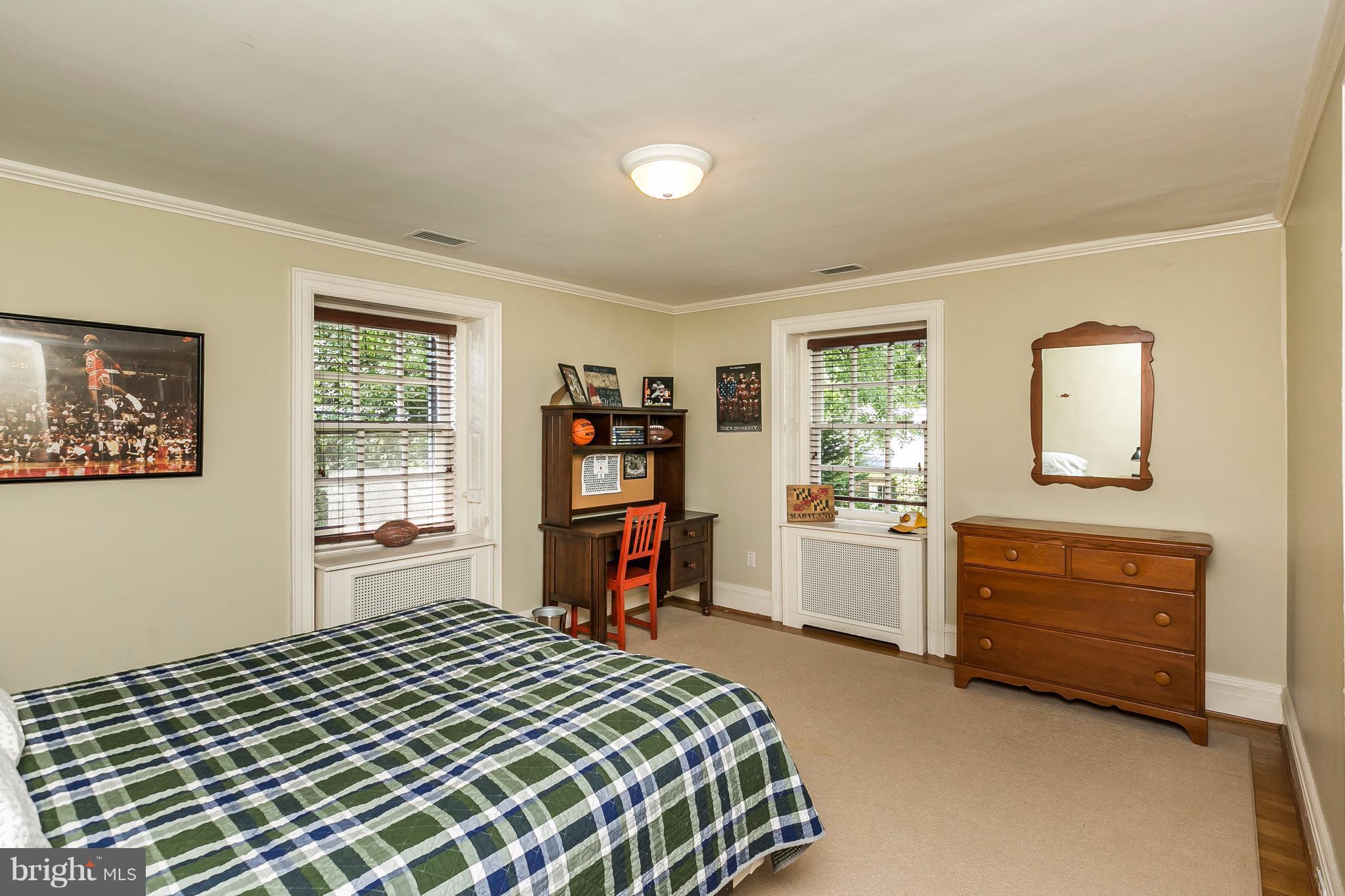6306 Blenheim Road Baltimore, MD 21212 - Photo 19 of 30 a bedroom with a bed and a window