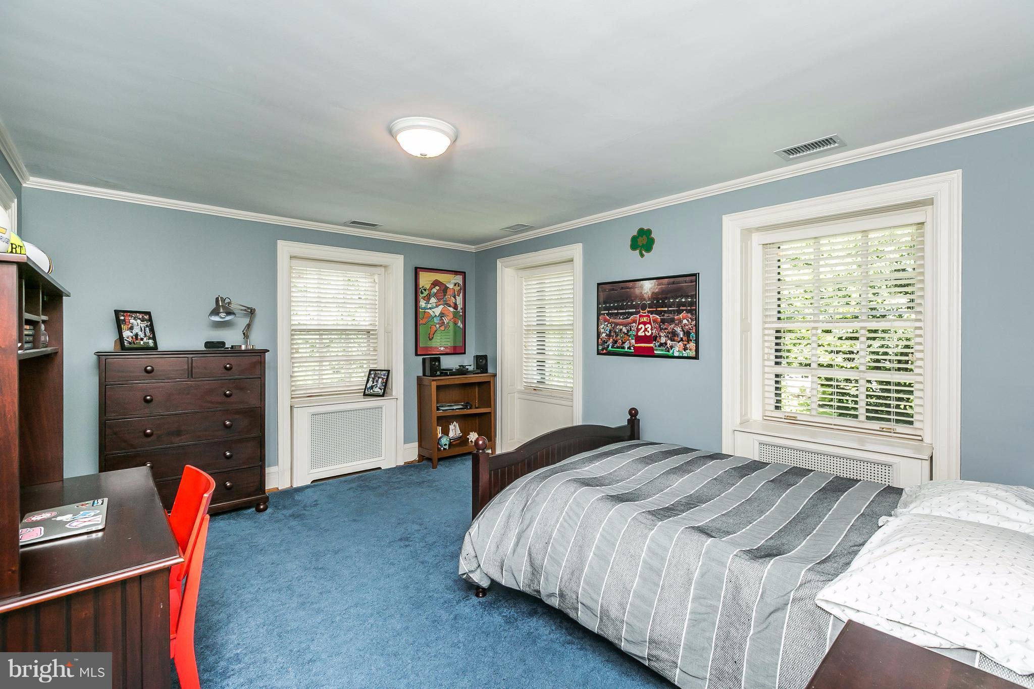 6306 Blenheim Road Baltimore, MD 21212 - Photo 20 of 30 a bedroom with a bed and a window