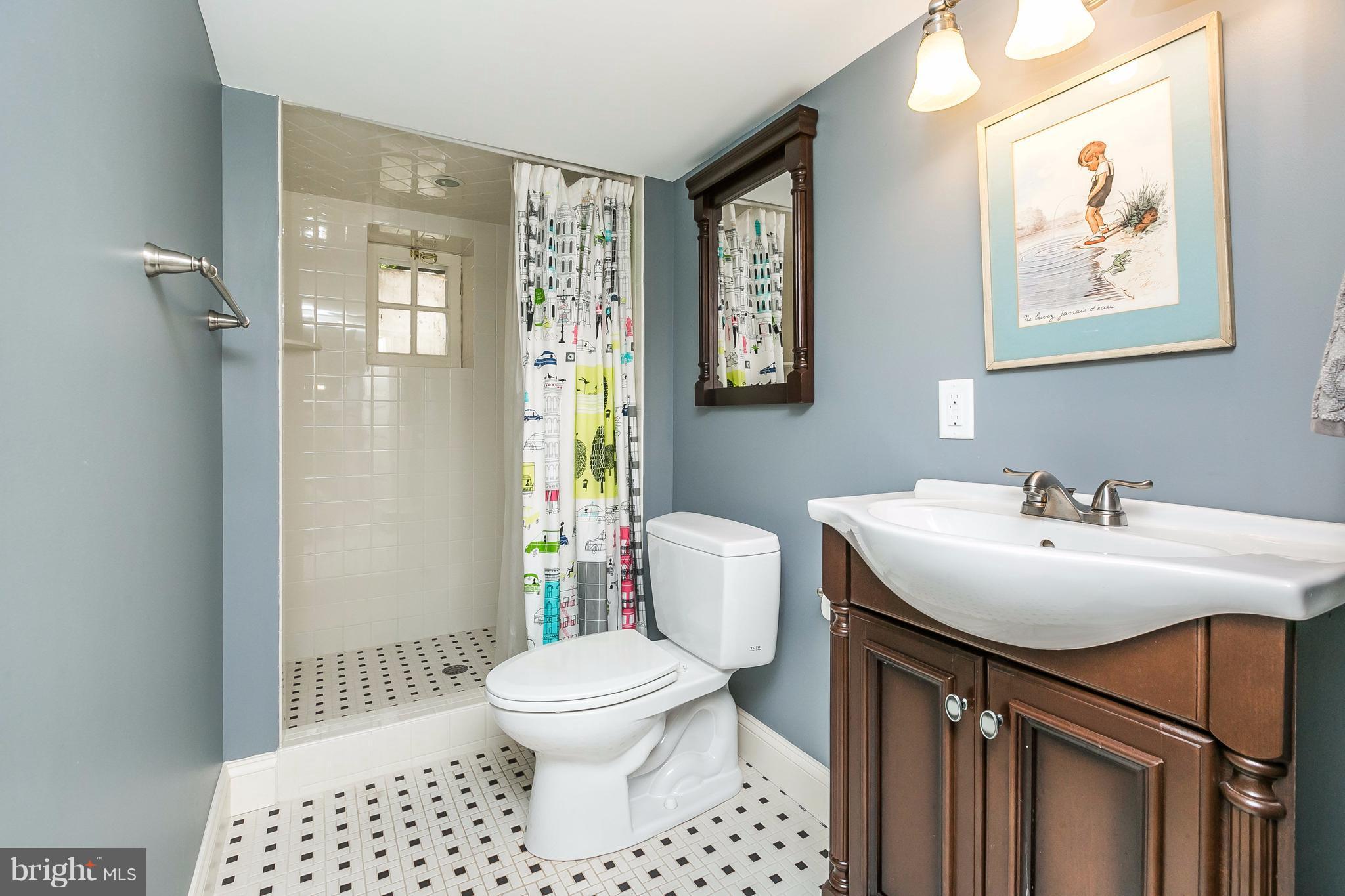 6306 Blenheim Road Baltimore, MD 21212 - Photo 26 of 30 a bathroom with a sink toilet and shower