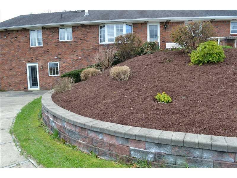 261 Darr Road Belle Vernon, PA 15012 - Photo 24 of 25 Yard/Garden. Nice walkway from "In-Law" living area and view of the great retaining wall and upper deck area which accesses the Kitchen / Dining Room with beautiful Bay Window.