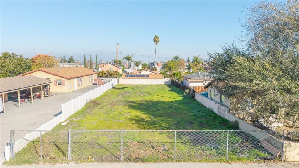 a view of a swimming pool with an outdoor seating and a yard