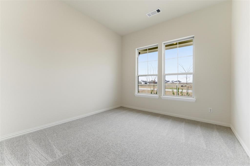 114 Brandywine Trail Rhome, TX 76078 - Photo 8 of 27 an empty room with a window