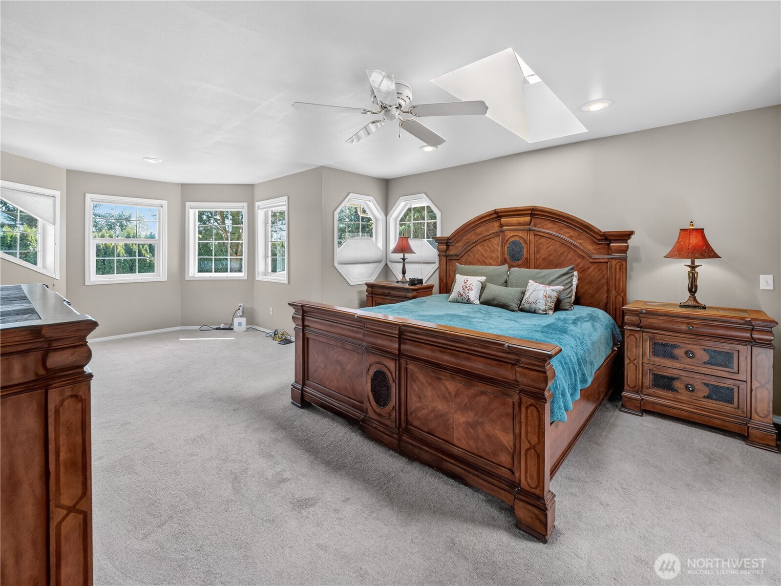 26224 Southeast 425th Street Enumclaw, WA 98022 - Photo 18 of 37 a bedroom with a bed and a chandelier