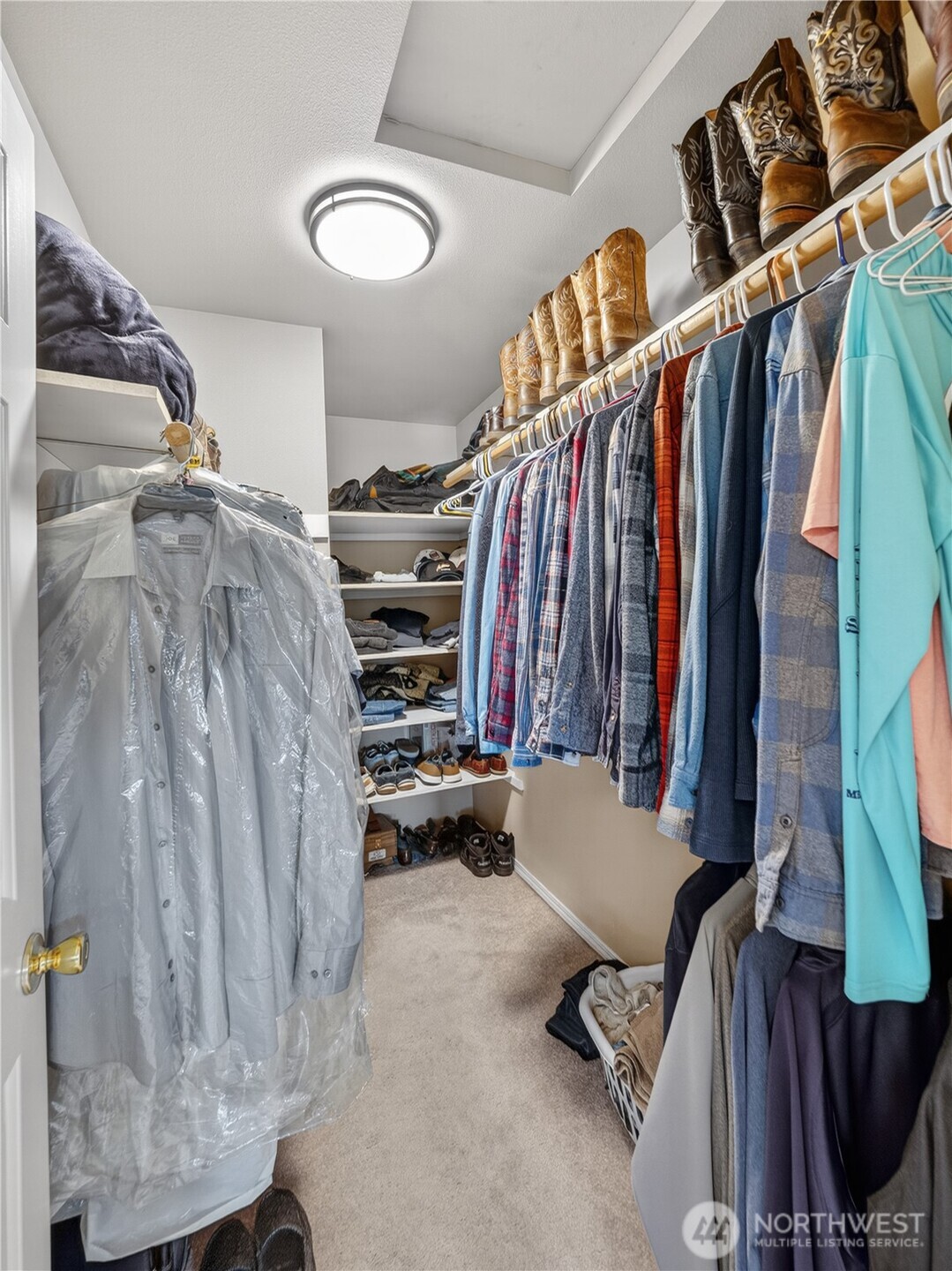 26224 Southeast 425th Street Enumclaw, WA 98022 - Photo 20 of 37 a view of walk in closet with clothes and shoes
