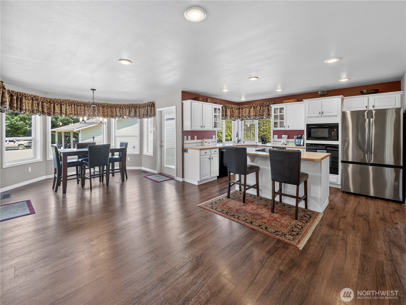 26224 Southeast 425th Street Enumclaw, WA 98022 - Photo 2 of 37 a view of a dining room with furniture window and wooden floor