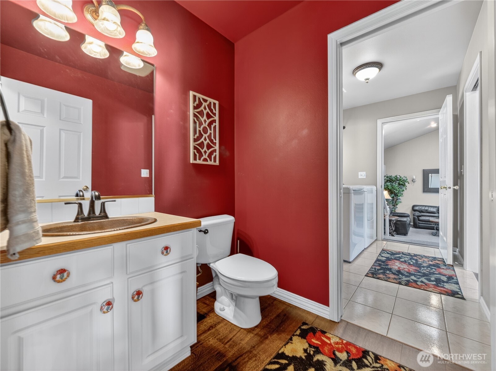 26224 Southeast 425th Street Enumclaw, WA 98022 - Photo 21 of 37 a bathroom with a sink a toilet a mirror and vanity