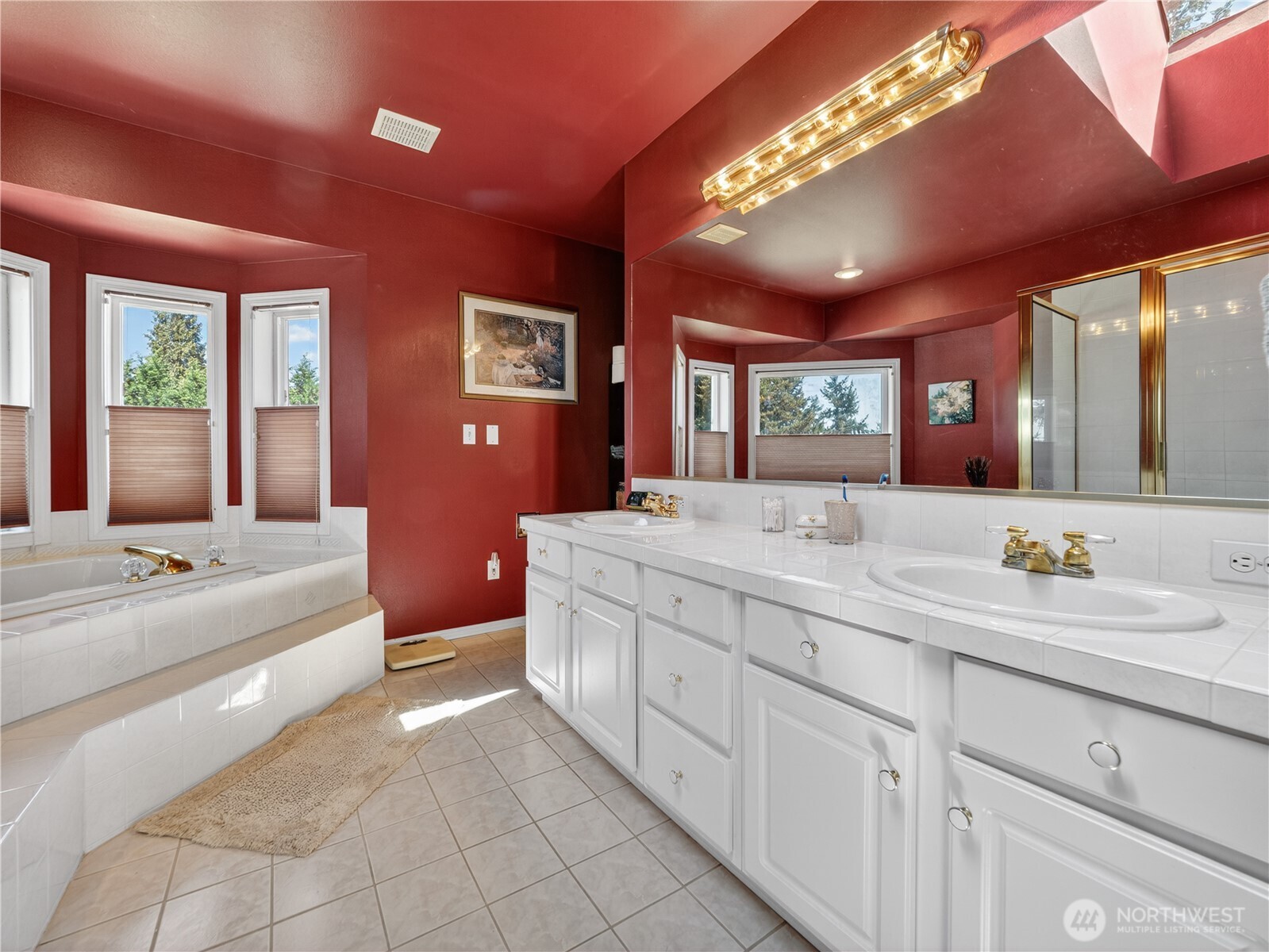 26224 Southeast 425th Street Enumclaw, WA 98022 - Photo 22 of 37 a spacious bathroom with a double vanity sink a large mirror and a bathtub