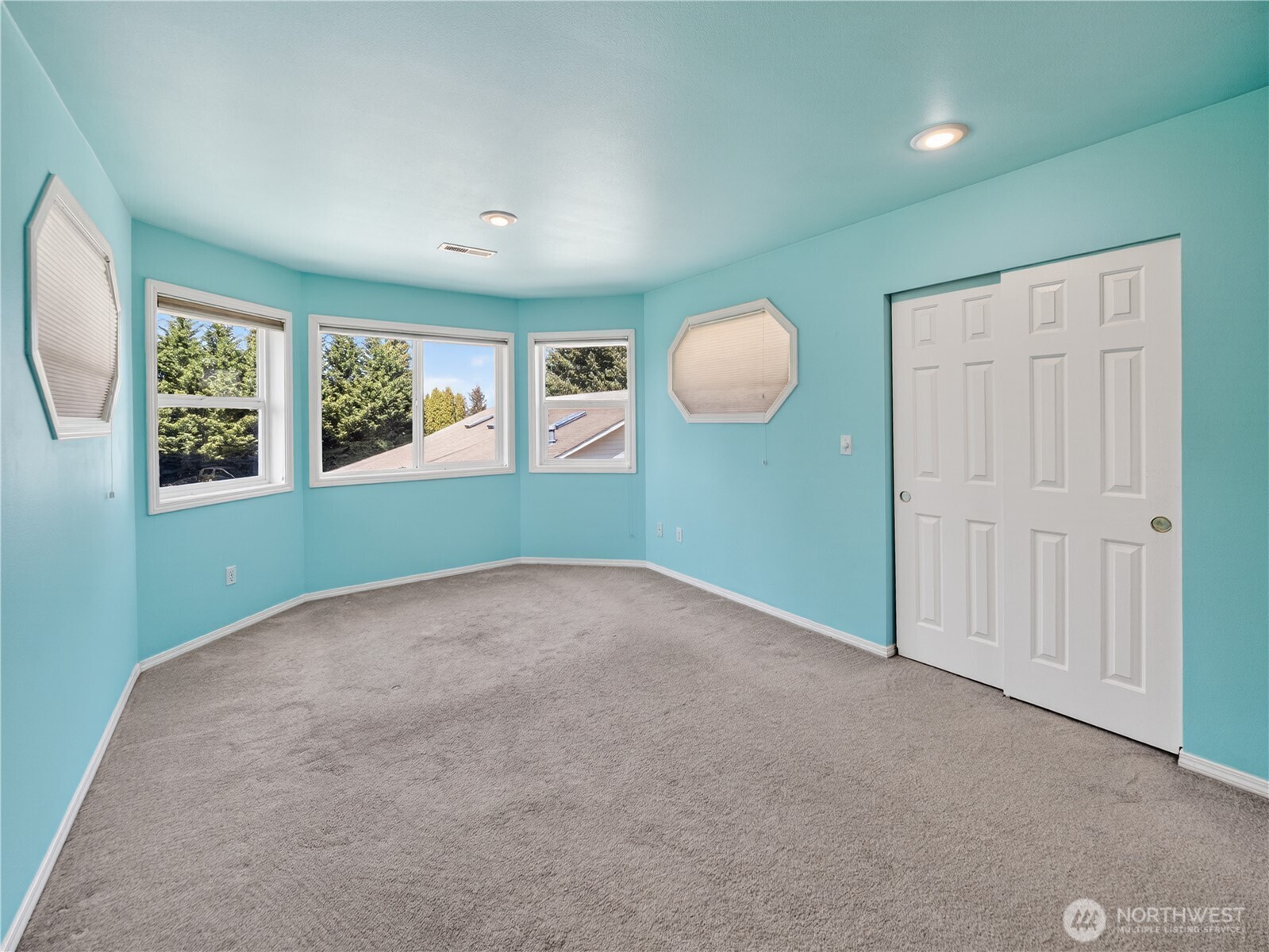 26224 Southeast 425th Street Enumclaw, WA 98022 - Photo 24 of 37 a view of an empty room with a window and wooden floor