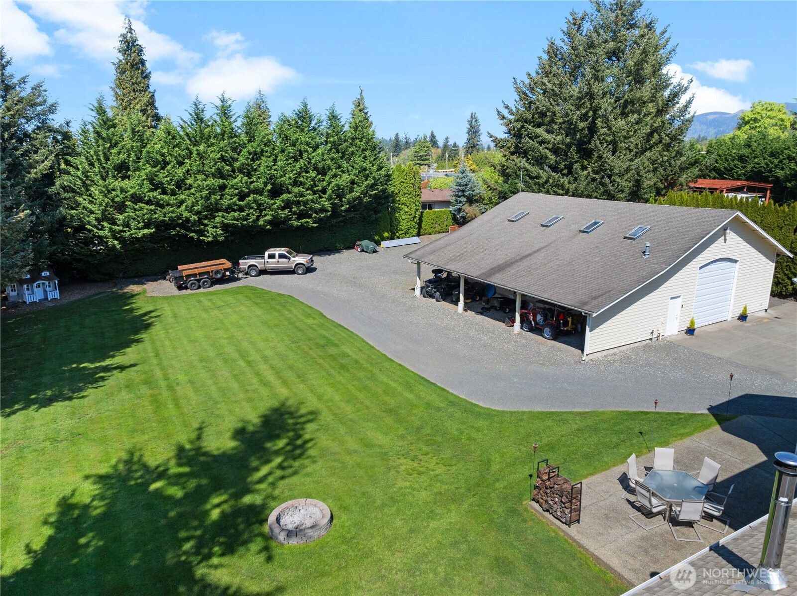 26224 Southeast 425th Street Enumclaw, WA 98022 - Photo 35 of 37 a aerial view of a house with swimming pool and big yard