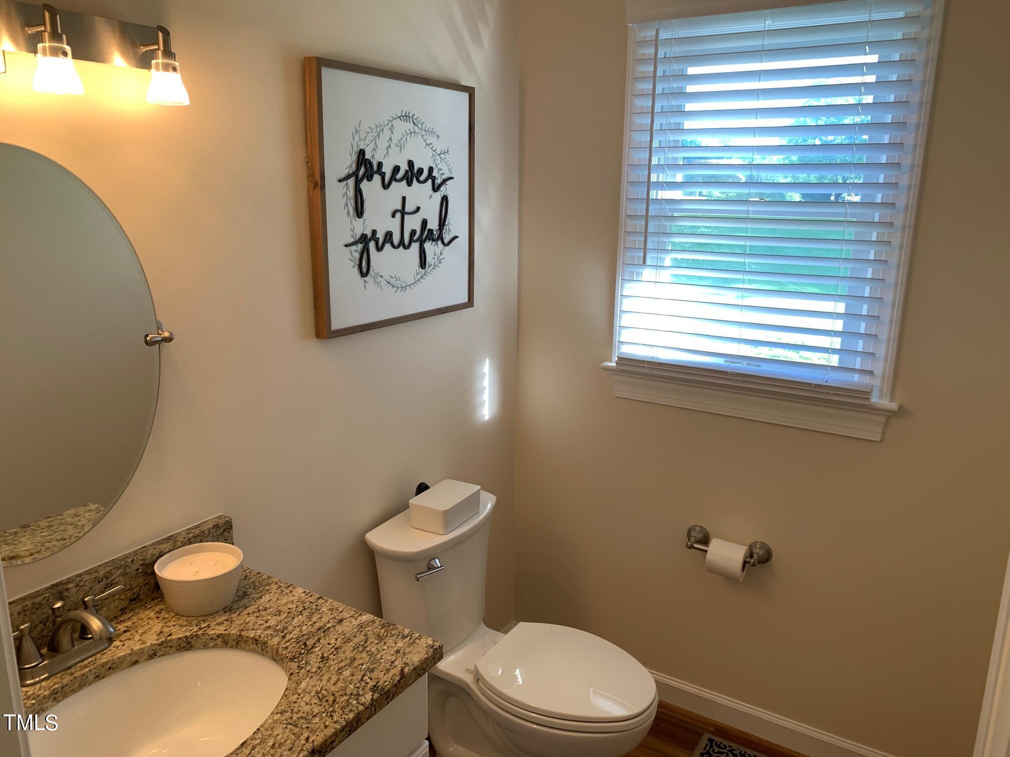 51 Fox Lane Roxboro, NC 27574 - Photo 17 of 25 a white toilet sitting next to a bathroom sink