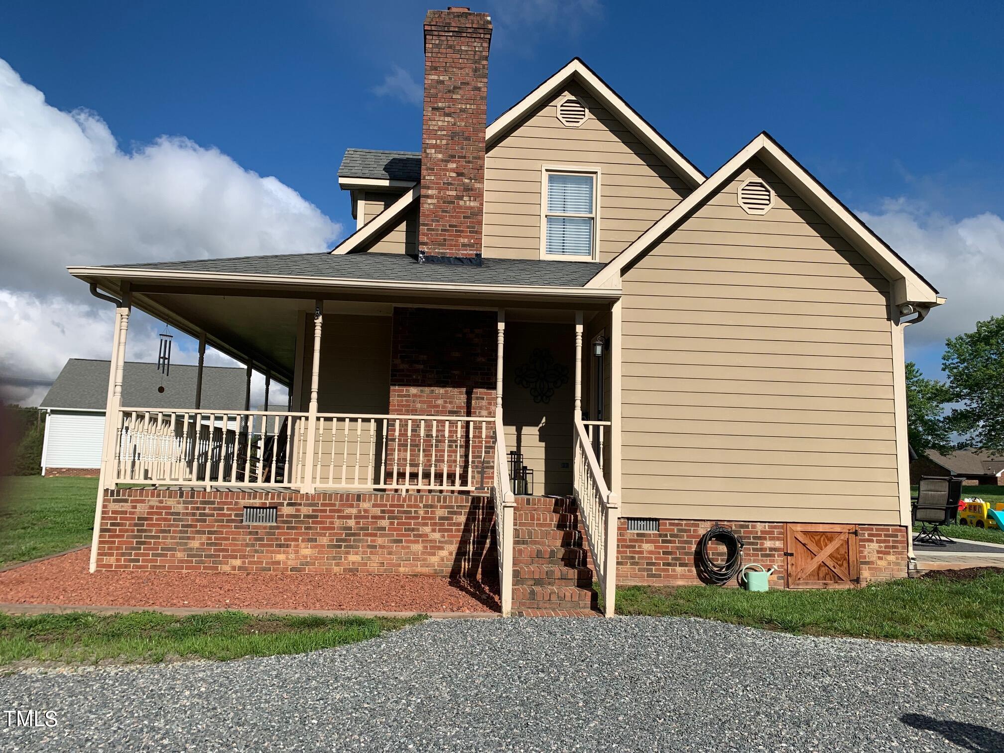 51 Fox Lane Roxboro, NC 27574 - Photo 2 of 25 a front view of a house with a yard