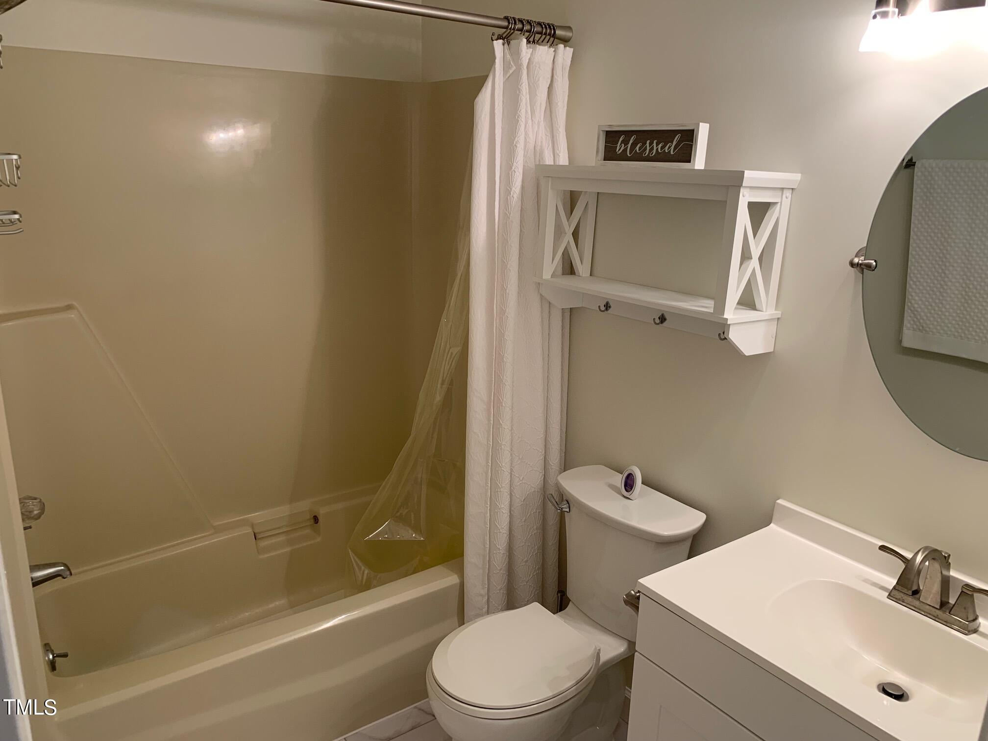 51 Fox Lane Roxboro, NC 27574 - Photo 23 of 25 a bathroom with a sink toilet and shower
