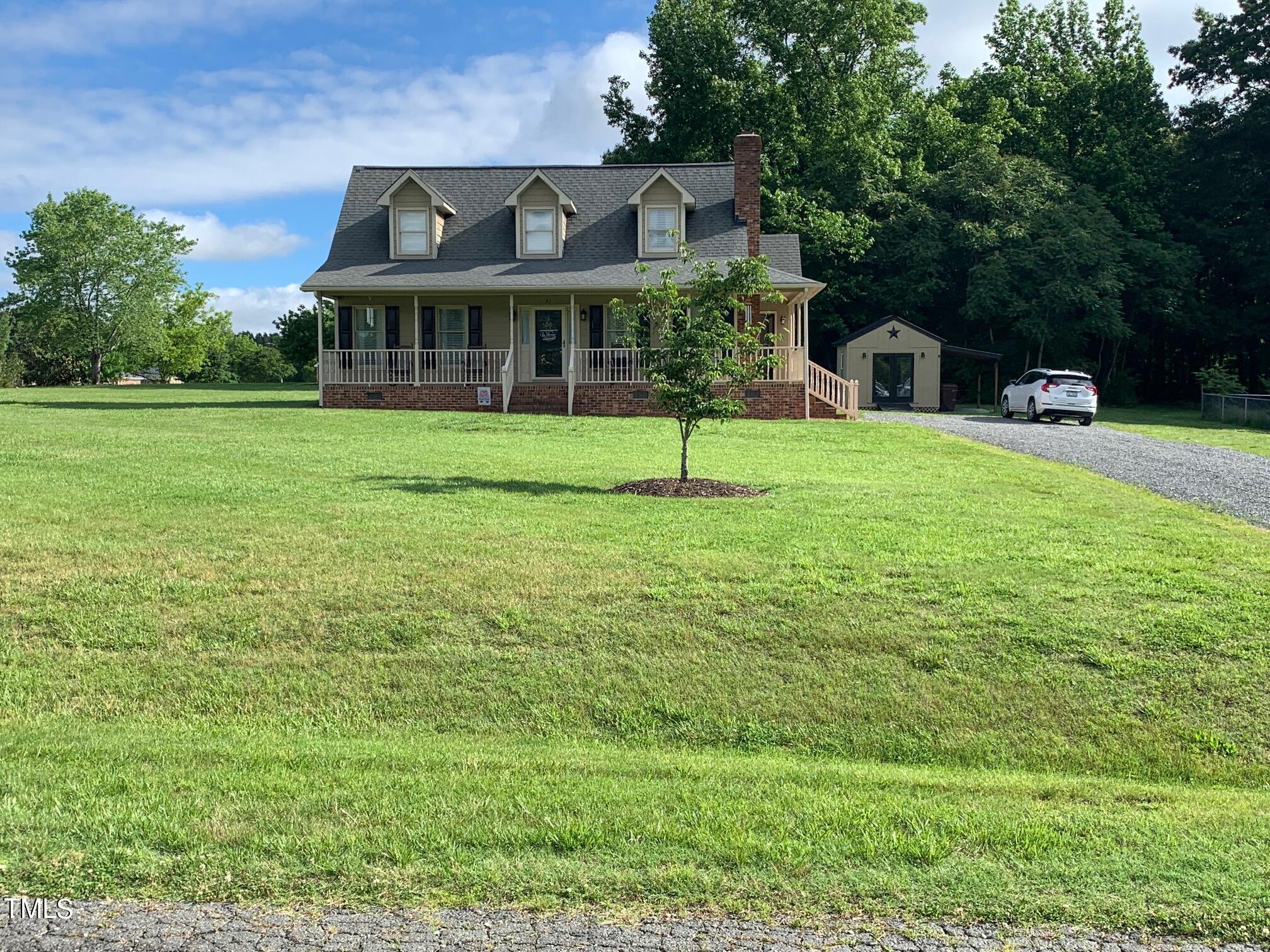51 Fox Lane Roxboro, NC 27574 - Photo 7 of 25 a front view of a house with a garden