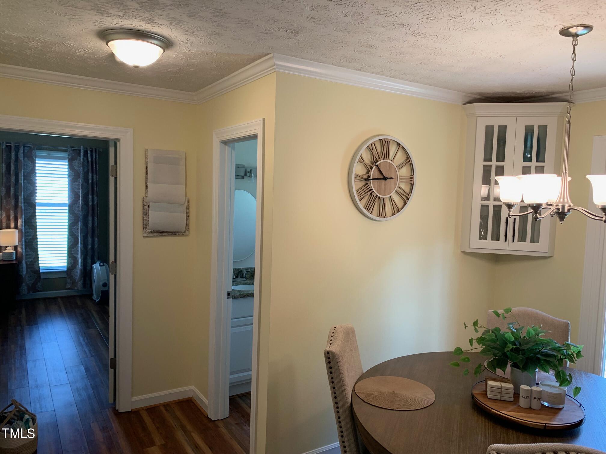 51 Fox Lane Roxboro, NC 27574 - Photo 10 of 25 a view of a dining room with furniture and wooden floor