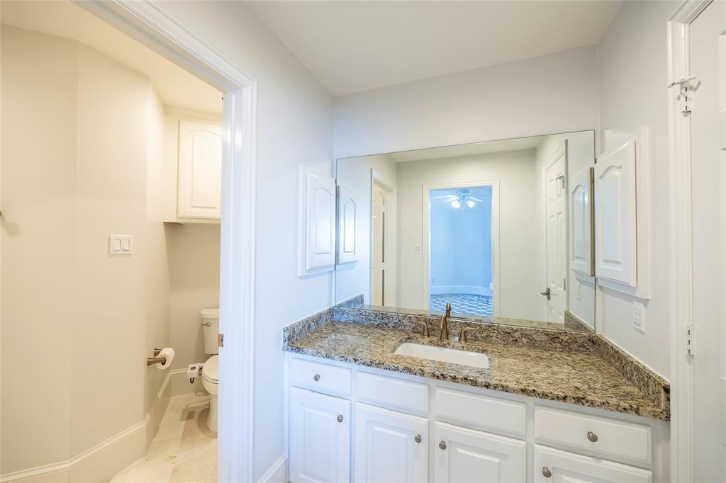 1190 Emerald Sound Boulevard Oak Point, TX 75068 - Photo 26 of 37 a bathroom with a granite countertop sink and a mirror
