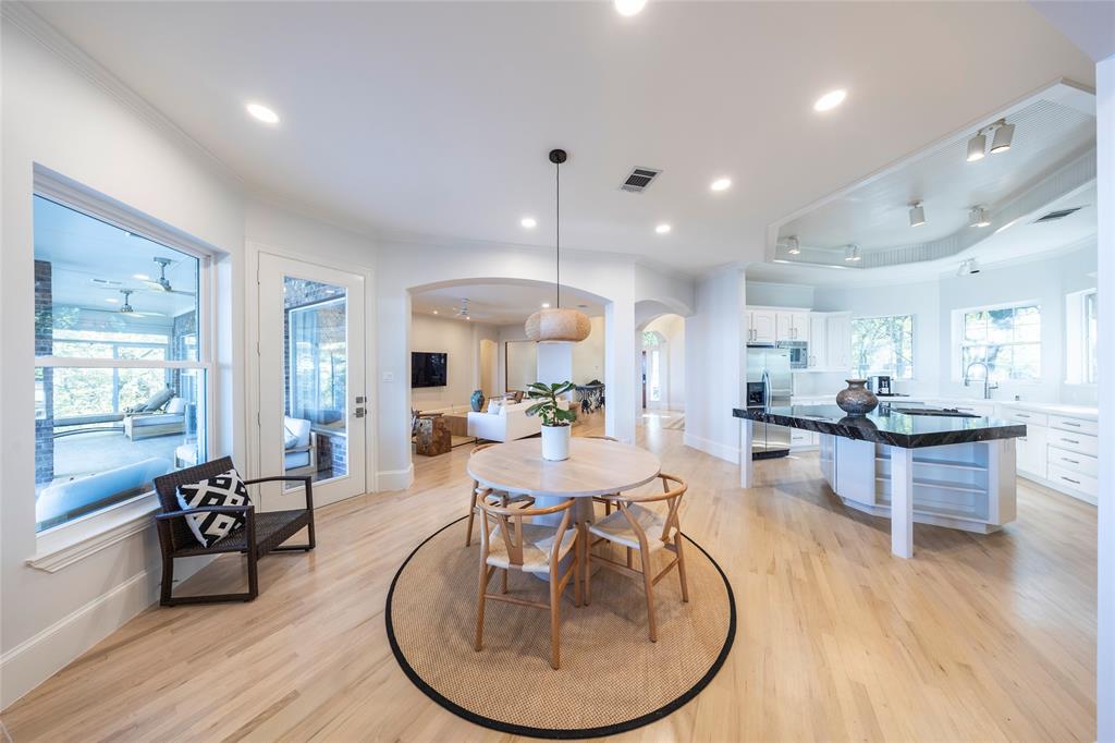 1190 Emerald Sound Boulevard Oak Point, TX 75068 - Photo 9 of 37 a view of a dining room with furniture window and wooden floor
