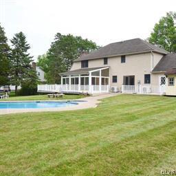 830 Macada Road Bethlehem, PA 18017 - Photo 34 of 35 a front view of a house with a garden and trees