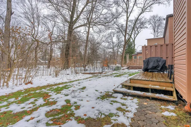 a wooden bench sitting in middle of yard