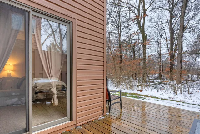 a view of a balcony with table and chairs