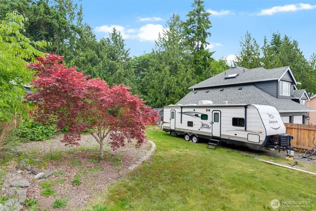 a aerial view of a house with a big yard