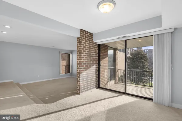 a spacious bedroom with a bed and a shower