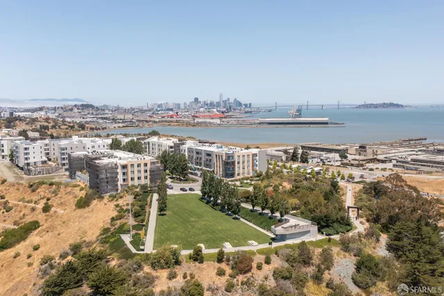 a view of a balcony with wooden floor and fence