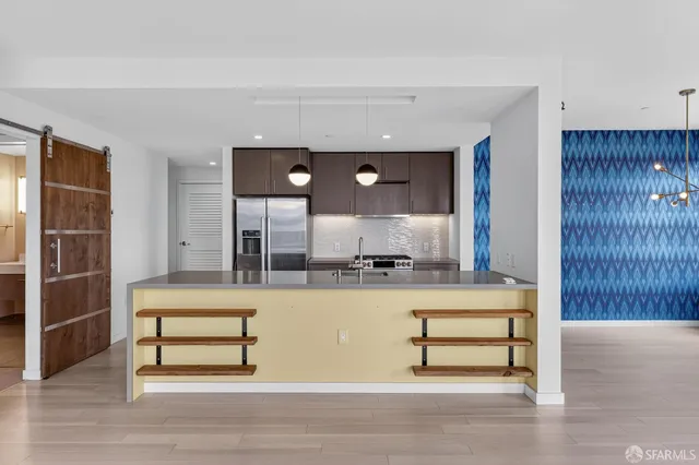 a view of living room with furniture and wooden floor