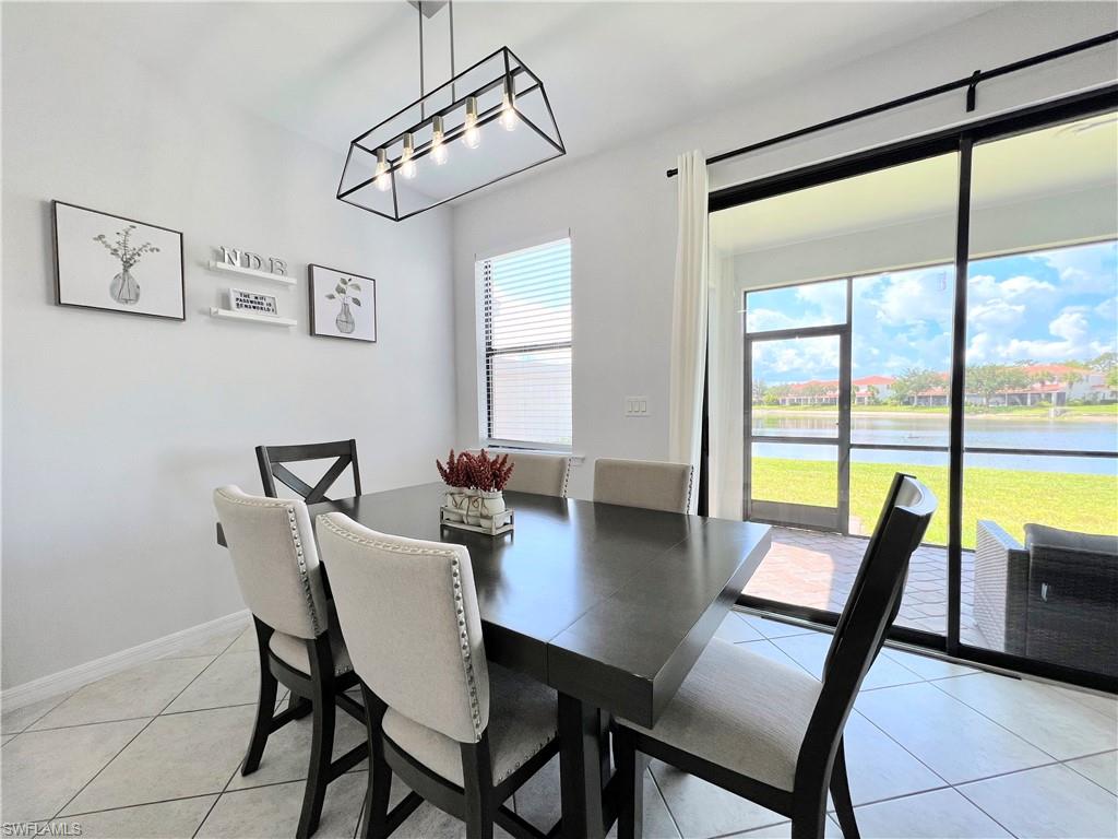 14776 Sutherland Avenue, Unit 416 Naples, FL 34119 - Photo 13 of 50 a view of a dining room and livingroom with furniture