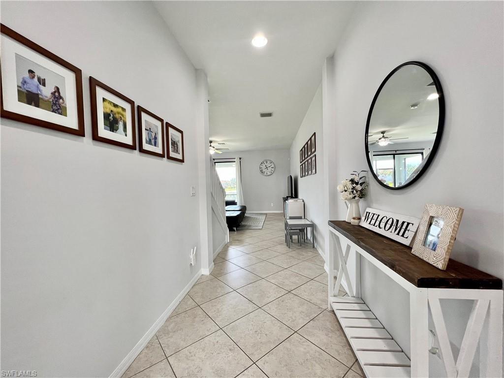 14776 Sutherland Avenue, Unit 416 Naples, FL 34119 - Photo 3 of 50 a view of a hallway with seating area