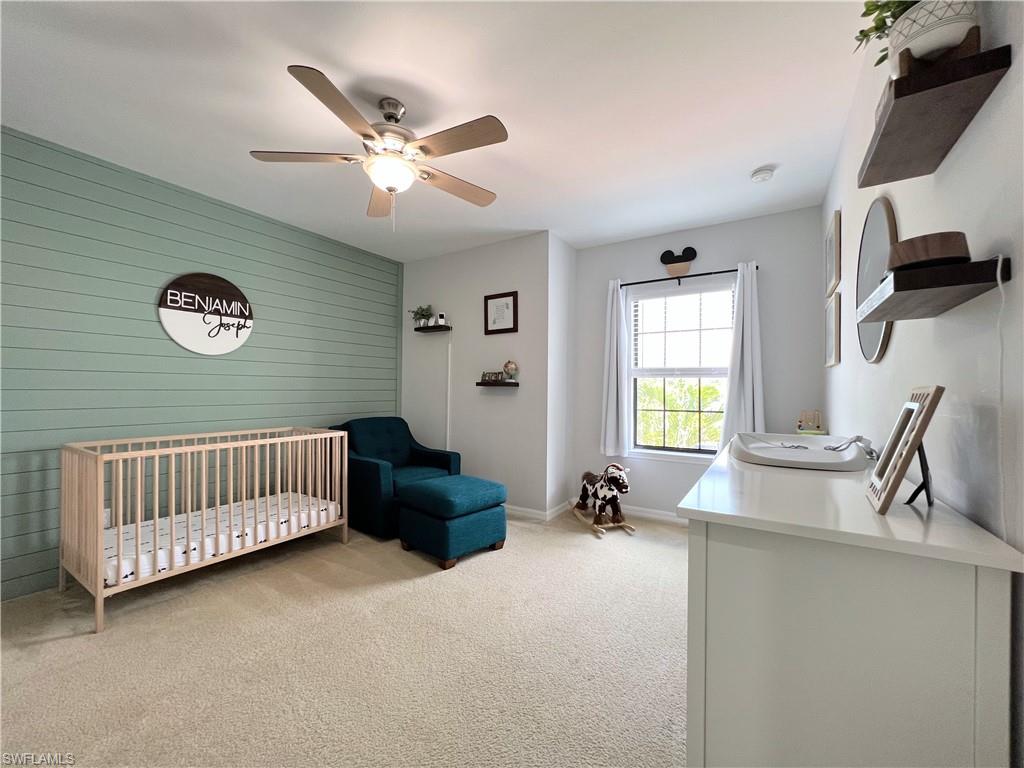14776 Sutherland Avenue, Unit 416 Naples, FL 34119 - Photo 33 of 50 a living room with furniture and a window