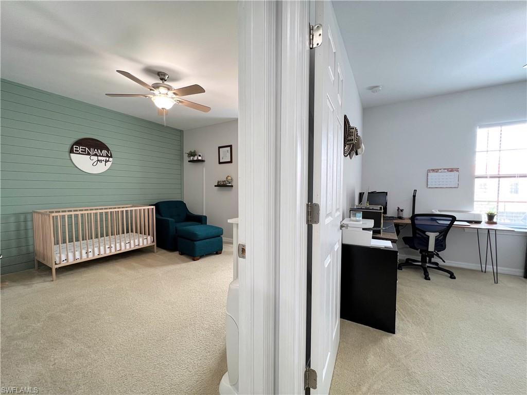 14776 Sutherland Avenue, Unit 416 Naples, FL 34119 - Photo 38 of 50 a view of a livingroom with workspace and a window