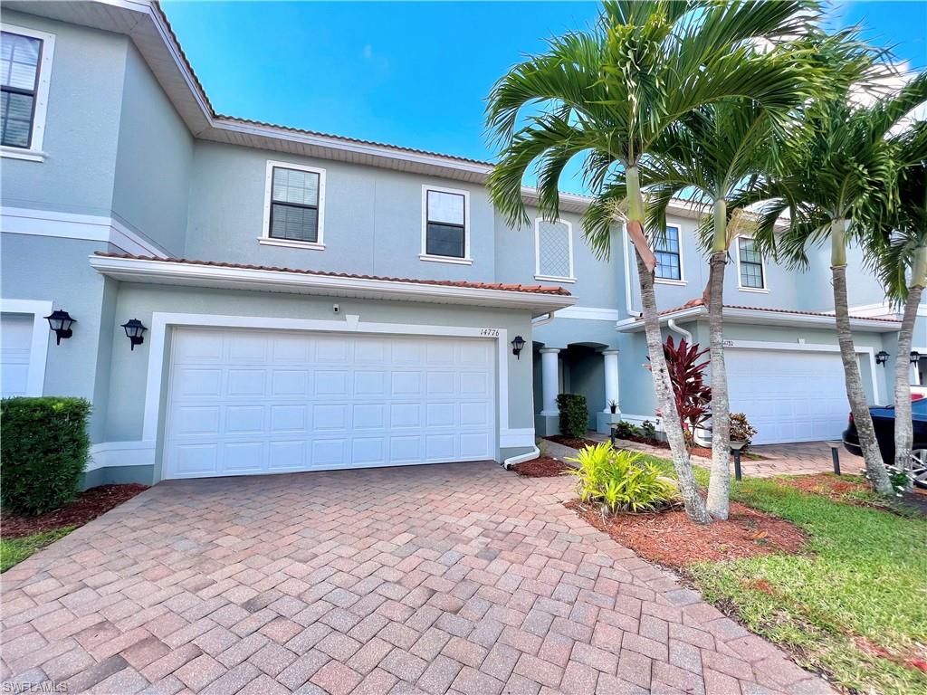 14776 Sutherland Avenue, Unit 416 Naples, FL 34119 - Photo 4 of 50 a front view of house with yard and trees