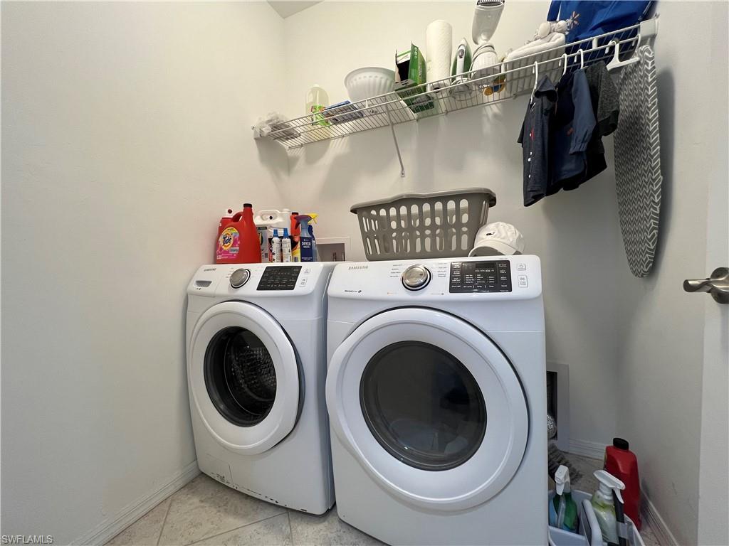 14776 Sutherland Avenue, Unit 416 Naples, FL 34119 - Photo 45 of 50 a utility room with dryer and washer